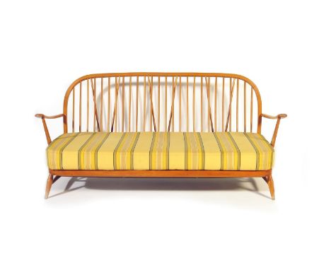 An Ercol Windsor Contemporary beech three piece suite designed by Lucian Ercolani,  comprising two seat sofa and two en suite