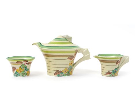 'Green Hydrangea' a Clarice Cliff Bizarre Daffodil tea trio, painted in colours, comprising teapot and cover, milk-jug and su