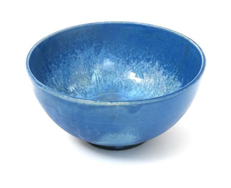 A rare Carter's Poole Pottery lustre bowl, footed form, covered in a streaked blue crystalline glaze, impressed Carter's Pool