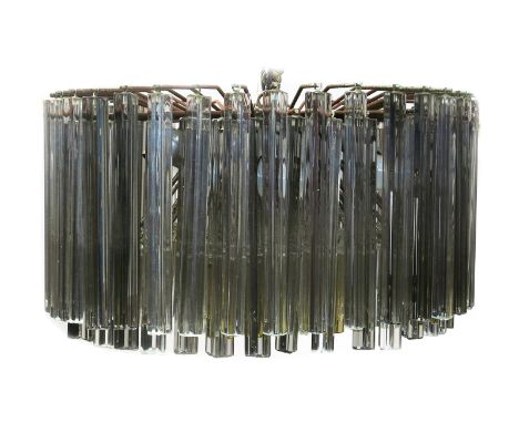 A Venini chrome metal and glass ceiling chandelier, four rows of radiating arms supporting faceted glass panels, 56cm. diam. 
