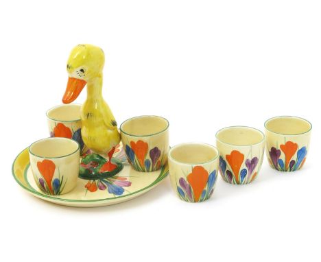 'Crocus' a Clarice Cliff Bizarre Duck egg cruet set, comprising tray and six egg cups, all painted in colours printed factory