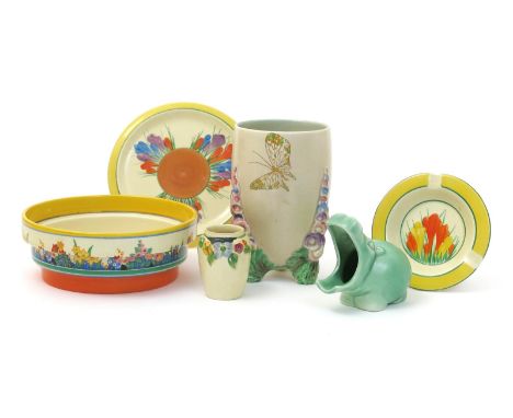 'Crocus' a Clarice Cliff Bizarre teapot stand, painted in colours inside a yellow band, a Crocus ashtray, a Chloris stepped b