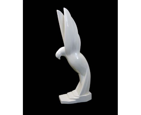 Le Pigeon S'Envole a ceramic bird sculpture by Jacques Adnet, on stepped base, covered in a white glaze, signed Adnet to the 