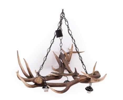 Antler Furniture: An Antler Mounted Chandelier, circa late 20th century, an antler mounted four-light chandelier, formed by t