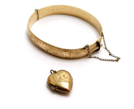 9ct gold metal core bangle t/w 9ct front &amp; back heart shaped locket (dent to front) - total weight 29g - SOLD ON BEHALF O