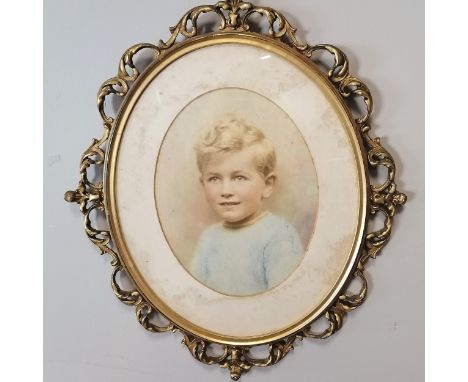 Hand tinted portrait photograph of a boy in a gilt wood florentine style frame with a Harrods label to reverse - 55cm x 48cm 