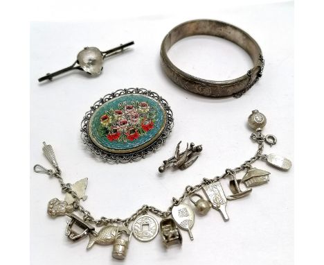 Unmarked silver? mounted micro mosaic brooch 5.2 cm across, silver bangle (dented), charm bracelet unmarked, etc. Total weigh