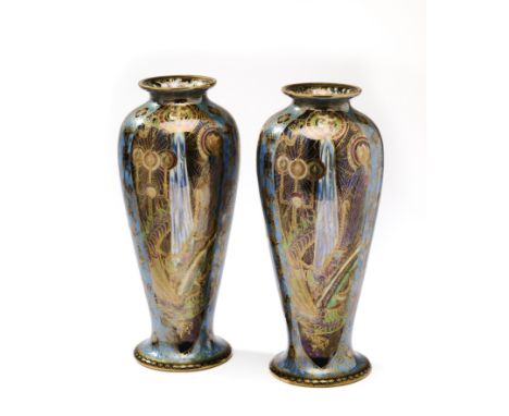 A PAIR OF WEDGWOOD FAIRYLAND LUSTRE VASES, CIRCA 1920 'Candlemas' pattern (No.Z5154) designed by Daisy Makeig-Jones, slender 