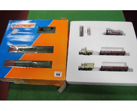 An 'HO' Scale Train Set No 41066 by Roco, comprising 0-4-0 diesel shunter and two wagons with vehicle load, appears little us