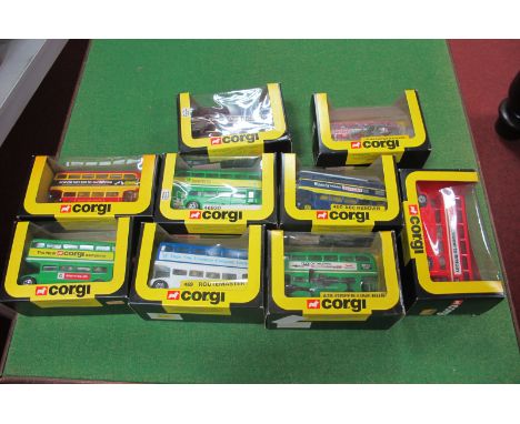 Nine 1980's Corgi Routemasters, all boxed including 'Pop on This Bus to HMV Shop'.