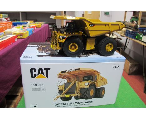 A 1:50 Scale Model of a CAT 797F Tie Mining Truck, by DM Diecast Masters, in yellow with original packaging and outer box.