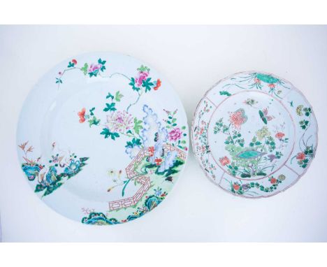 A Chinese Famille Verte dish, Kangxi, 18th century, painted in enamels with butterflies above peony, convolvulus and rockwork