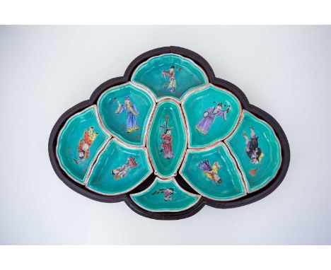 A Chinese hors d'oeuvre set in the form of a butterfly, each dish painted in polychrome enamels with a deity, against a light