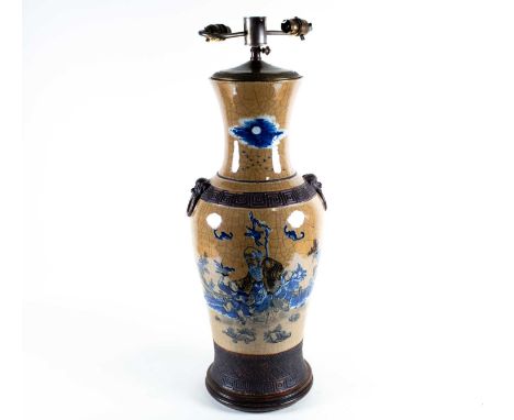 A large Chinese cafe au lait vase, 19th century, decorated with Shoulao, attendants and bats, painted in black with blue &amp