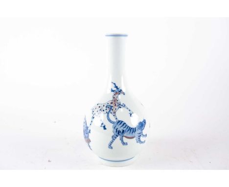 A Chinese mythical creatures vase, painted in underglaze blue and iron red, pseudo six character Kangxi marks, 23 cm high.Con