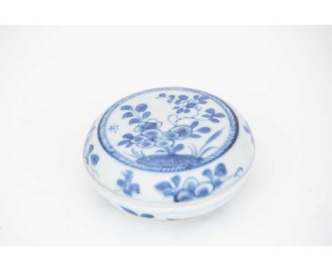 A Chinese Kangxi period blue and white box and cover, early 18th century, of circular form, the cover decorated with flowers 