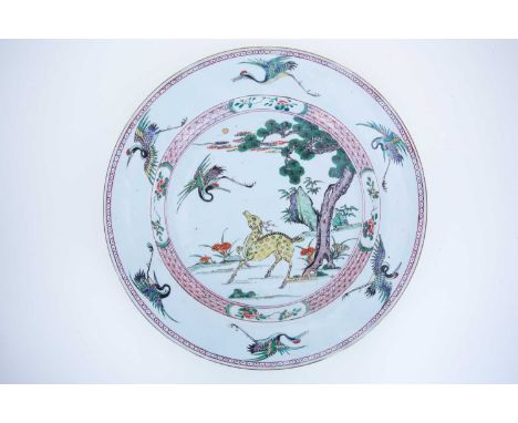 A large Chinese famille verte charger, Kangxi, painted in enamels with a yellow Sika deer amongst lingzhi mushrooms and rockw