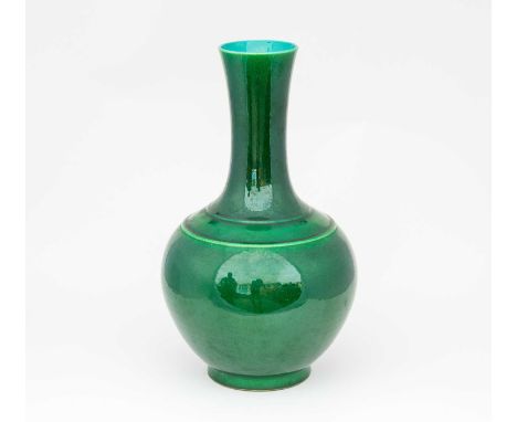 A Chinese monochrome vase, 19th/20th century, with gently flaring rim and waisted neck above a banded shoulder and globular b