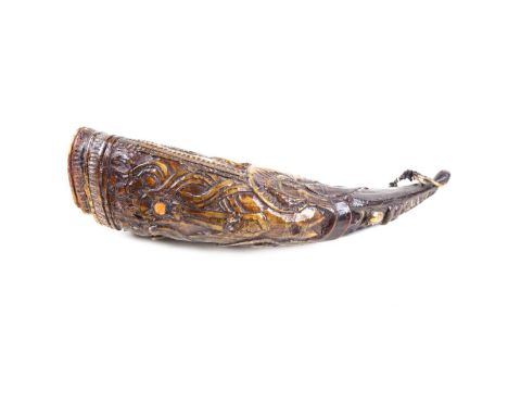 An interesting buffalo horn, probably 18th century Tibet, the body well carved with (apparently) an octopus, with large eyes 