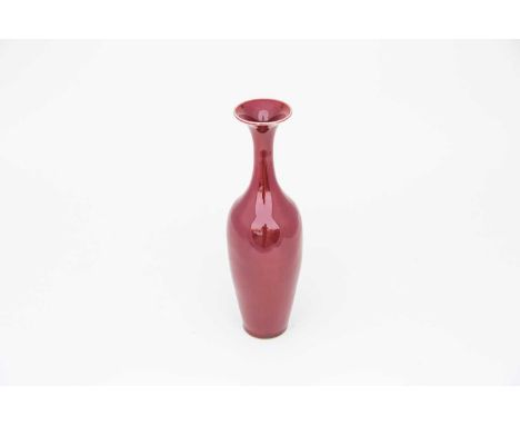 A Chinese sang de boeuf willow leaf vase, Liuyeping, Qing Dynasty, 19th century, of slender form, the white rim above a unifo