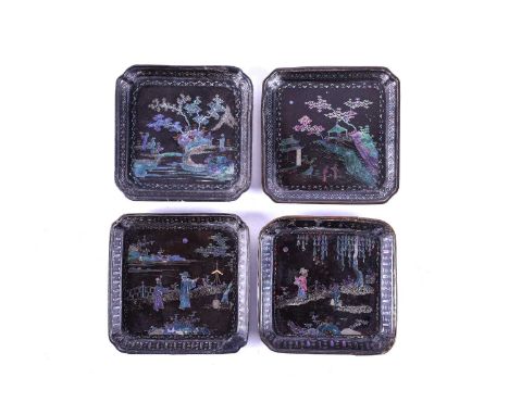 Four Chinese Lac Burgaute square dishes, probably 18th century, each depicting figures in garden landscapes, the dishes with 