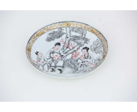 A good Chinese export saucer, circa 1740, pencilled en grisaille with a seated maiden, a man and boy leaving her, a large tre