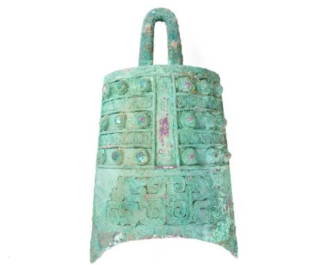 A large Chinese bronze Bo, Eastern Zhou dynasty (770 - 256BCE), with studs and scrolls under heavy Verdigris, 35cm, purchased