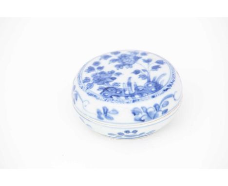 A Chinese Kangxi period box and cover, early 18th century, of cylindrical form, decorated with peony amongst rockwork, the si