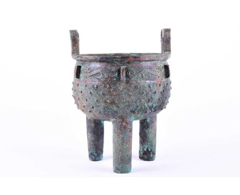 A Chinese bronze archaic ritual Ding, late Shang - early Western Zhou Dynasty, with rectangular loop handles and everted rim 