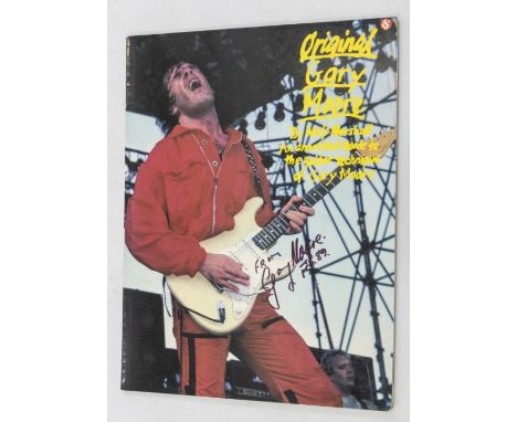 GARY MOORE - Wolf Marshall book annotated guide to the guitar technique of Gary Moore signed on the front cover ` FROM Gary M