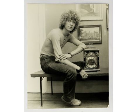 DAVID BOWIE - Original 8.5 x 6.5 black and white photograph of David leaning against a mantle clock. Original S.K.R. Photos I