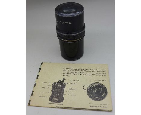 A Curta calculator type 1, no.10300 with instruction leaflet