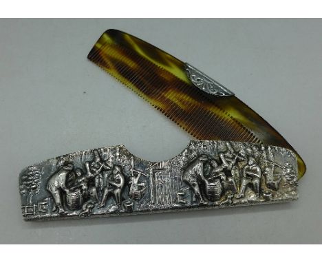 An embossed Danish silver comb with tavern scene
