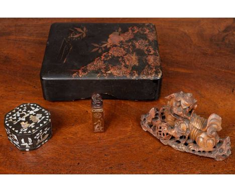 The lot comprising of a soapstone seal surmounted by a coiled snake and a 19th century soapstone dog of fo; a Chinese mop box