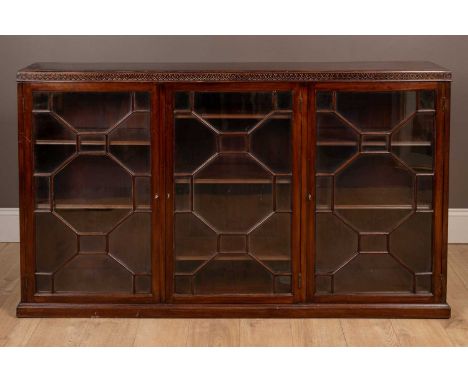 Each of the three astragal glazed doors opening to reveal three adjustable shelves.165cm wide x 29cm deep x 97cm highSome sig