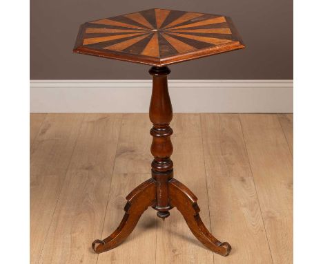 The inlaid top with alternating woods of burr walnut and mahogany radiating from the centre, on a turned support raised on tr