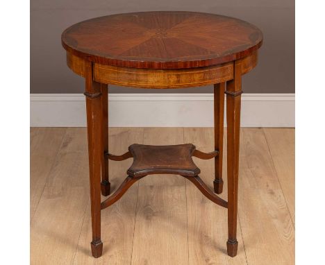 The circular table with radiating veneers and decorative inlay within a rosewood cross banded border, all standing on square 