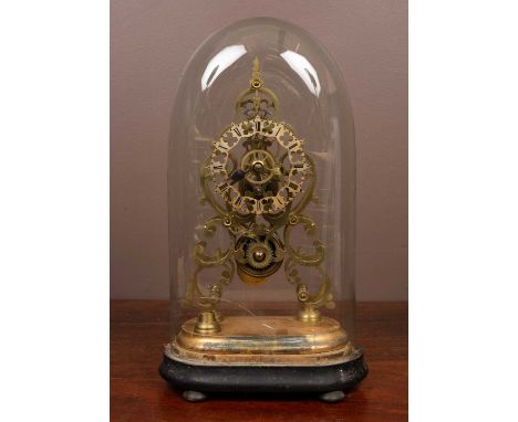 With scroll-decorated pierced frame and silvered pierced chapter ring, all mounted on a gilt and ebonised wooden plinth and u