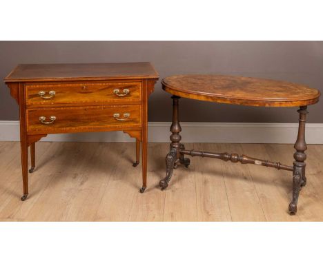 A burr walnut oval-topped centre table on a turned support, the cabriole legs terminating in castors; and an Edwardian side t