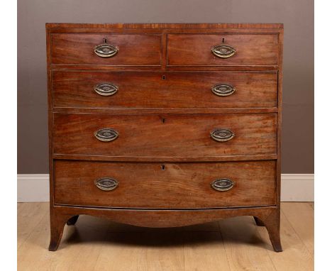Two short and three long drawers with oval plates to the drop handles, and on shaped bracket feet.105cm wide x 47cm deep x 10