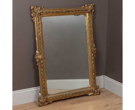The frame of gilt plasterwork and the corners embellished with scrollwork and leaf moulding.113cm x 81cmSome of the plasterwo