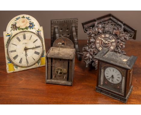 One a cuckoo clock with an automaton cuckoo and bellows, and a brass plated movement striking on a gong. The other a Black Fo