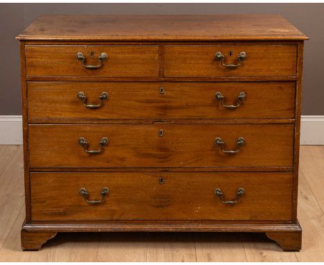 With two short over three long graduating drawers wth swan neck handles, all standing on bracket feet.110cm wide x 52cm deep 