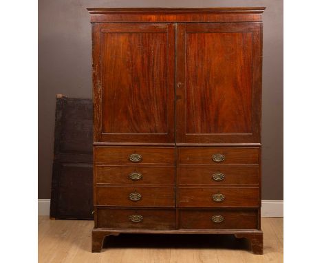 With panelled doors to the front over six faux drawers and two further drawers beneath, all standing on bracket feet. 143cm w