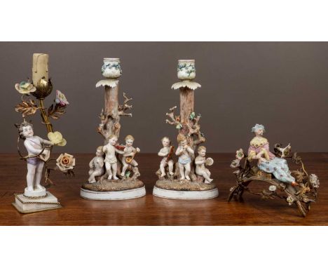 A collection of porcelain to include a pair of figural candlesticks by Bohne Sohne; a gilt-mounted porcelain candlestick conv