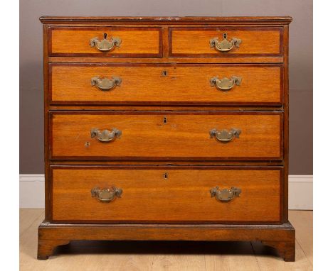 With mahogany cross banded decoration. The chest with two short and three long graduated drawers on bracket feet.94cm wide x 