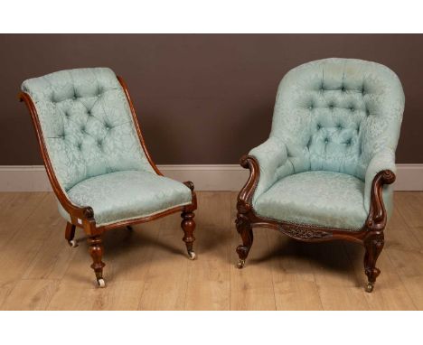 Both upholstered in light blue silk. The first with outsplayed arms, a shaped apron and raised on cabriole legs and castors. 