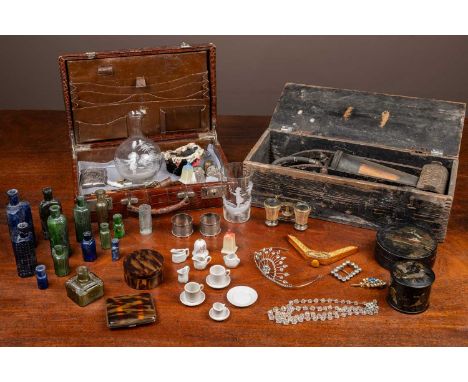 The lot to contain two silver napkin rings; a paste tiara; various old bottles; an enamel-decorated bottle; glass lacquer-dec