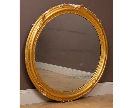 With moulded frame and original mirror plate.120cm diameterThe cresting to the top and bottom lacking and the remaining mould