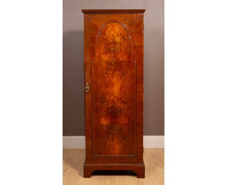 With a single door and standing on bracket feet.64.5cm wide x 48cm deep x 175cm highMinor marks, dents and scratches overall 